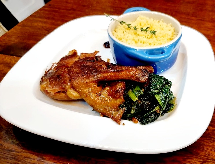 DUCK CONFIT WITH SAUTE SPINACH AND COUSCOUS